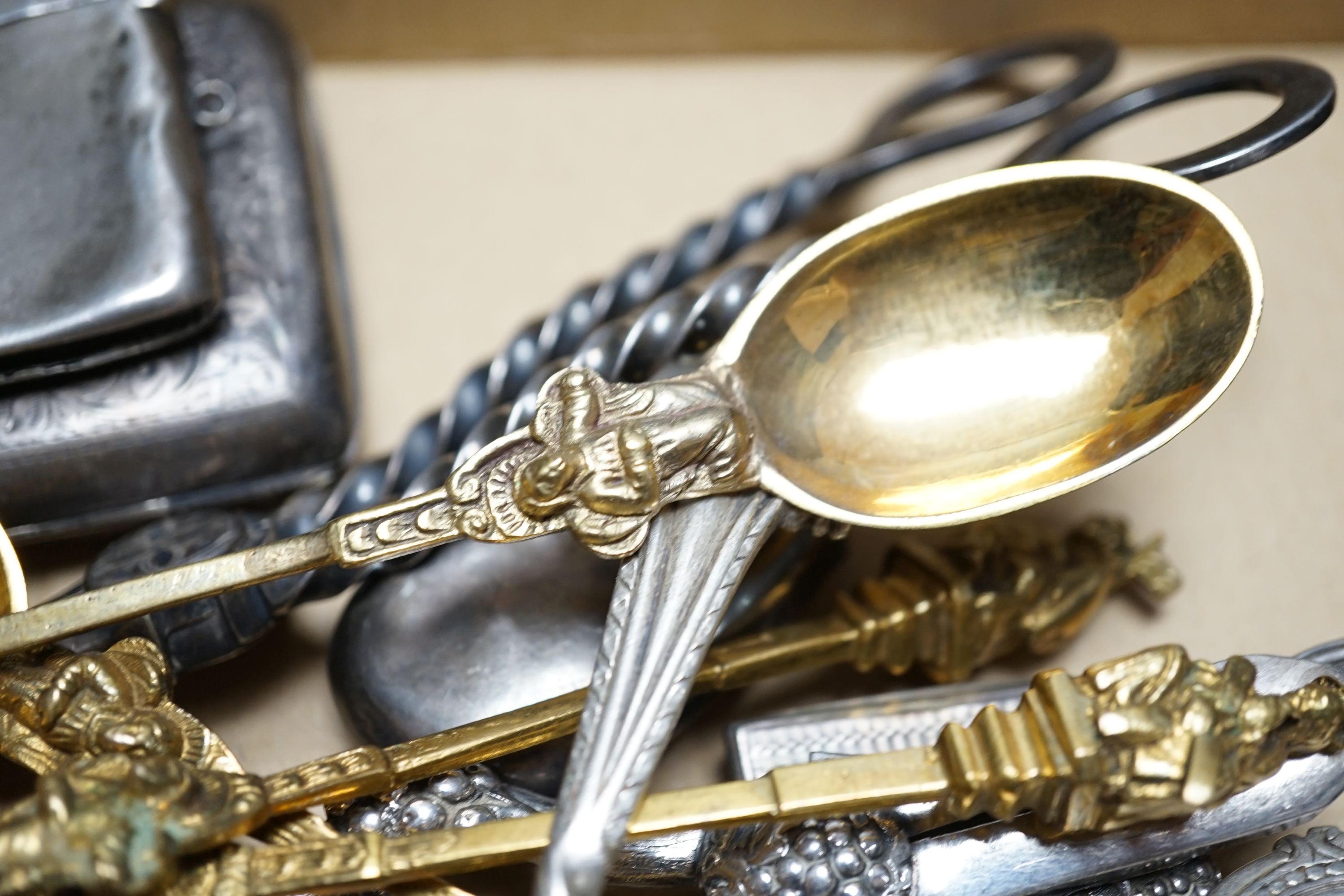 A cased Victorian silver part communion set, a silver cigarette case, two silver napkin rings, a set of five pierced silver bonbon dishes, a pair of Victorian silver grape shears, Georgian silver vinaigrette, pair of sil